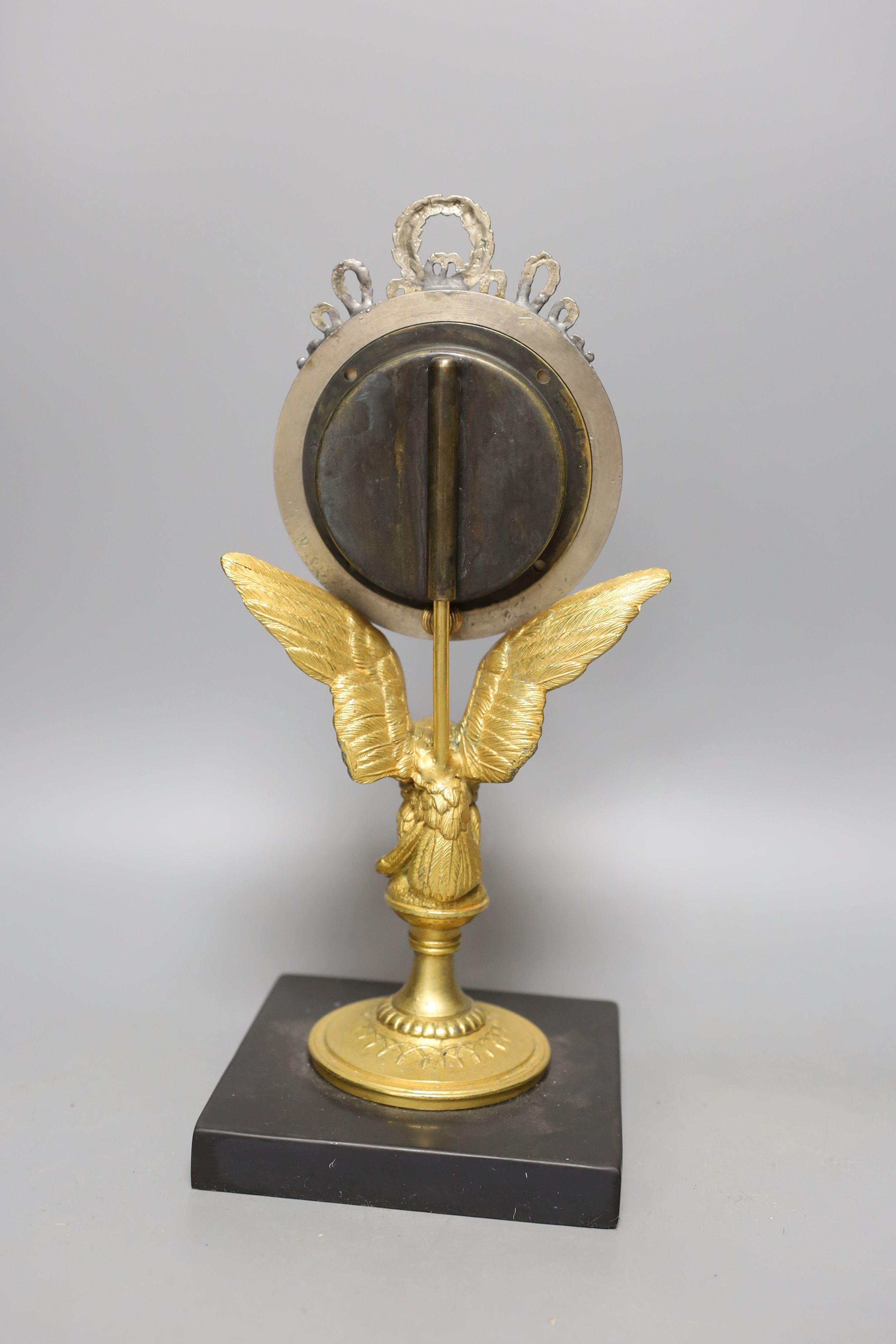 A gilt metal 8 day ‘eagle’ desk timepiece with marble slab base 30cm